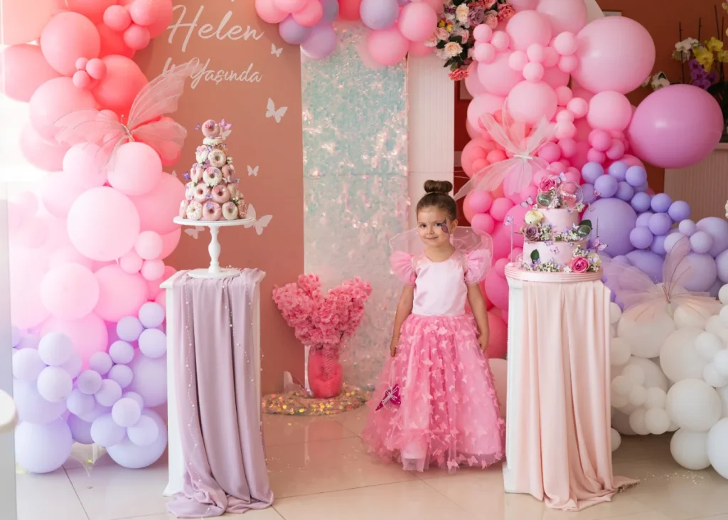 Girl in a pink dress at a themed birthday party in Kusadasi
