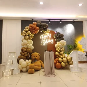 Teddy bear first birthday decoration with gold and brown balloons