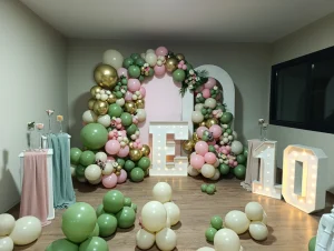 Sage green and cream 10th birthday balloon decoration with light-up numbers