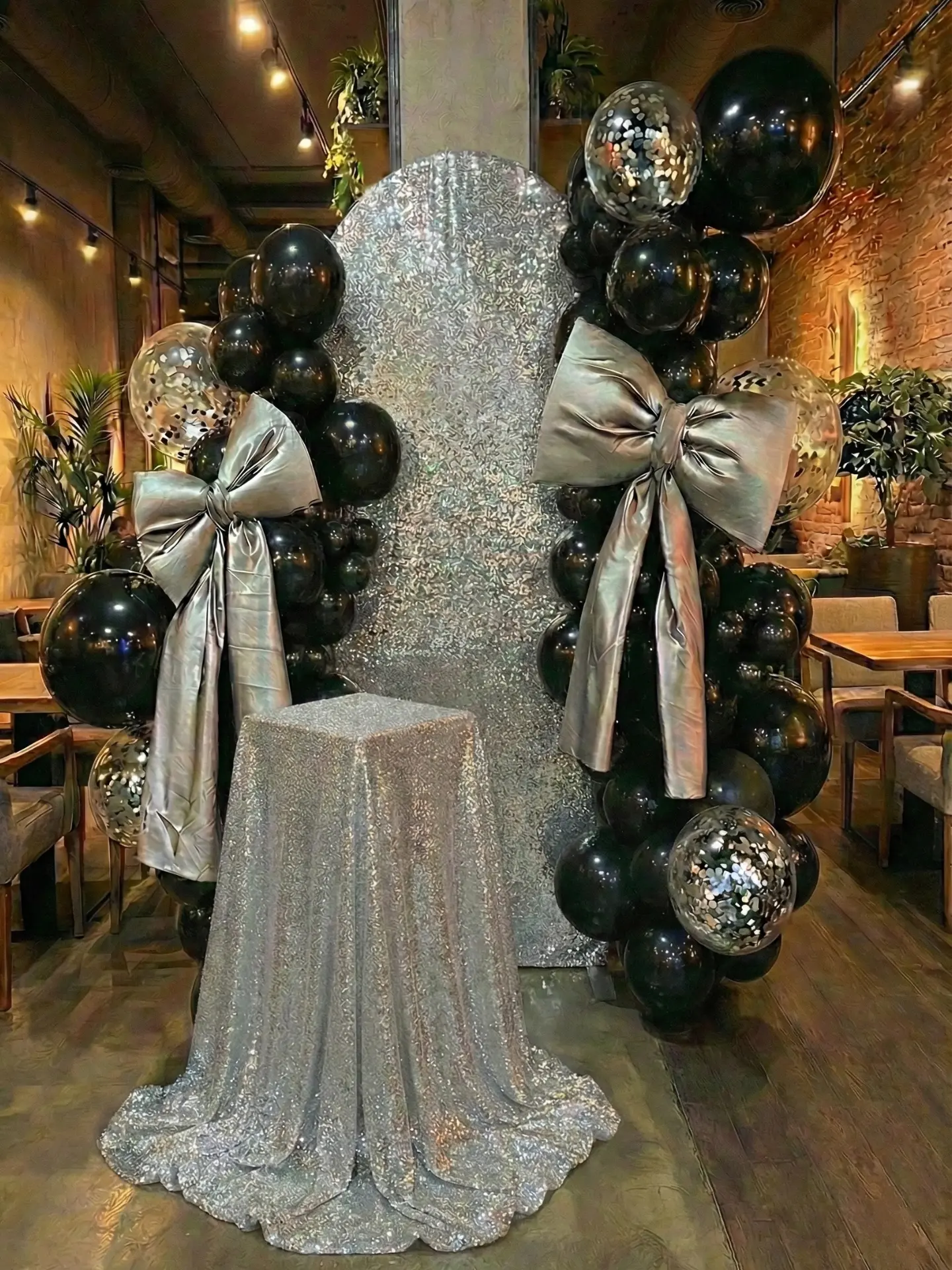Birthday party in Kusadasi cake table with silver decoration, big bows and balloons