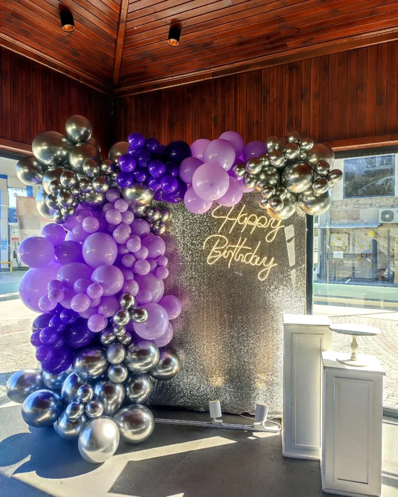 Colourful balloon decoration on a dark backdrop for a teen birthday party