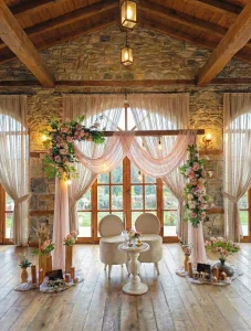 Engagement ceremony Turkey setup with pink and white drapes and flowers in a stone venue