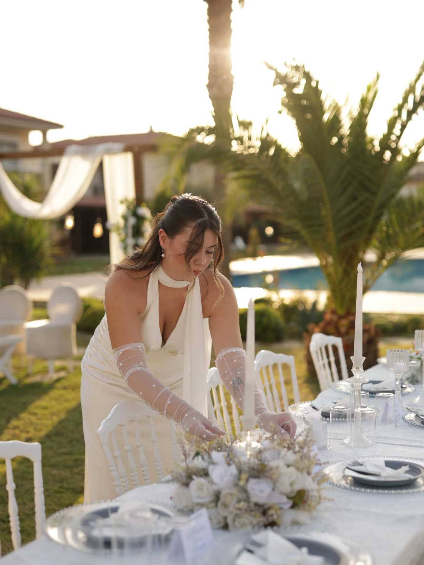 Bride in a white dress at a garden engagement celebration in Kusadasi