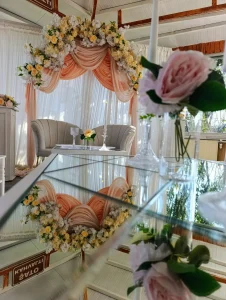 White chairs and drapes at an engagement ceremony setup in Kusadasi