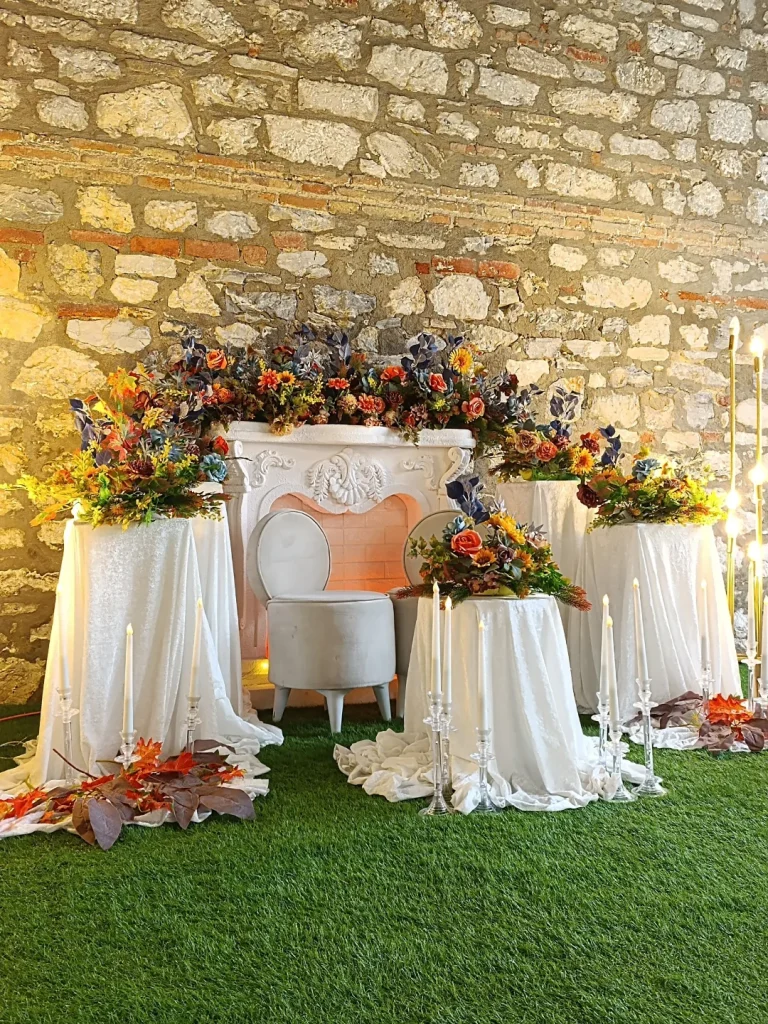 Celebration table with white draped fabric and balloon decoration