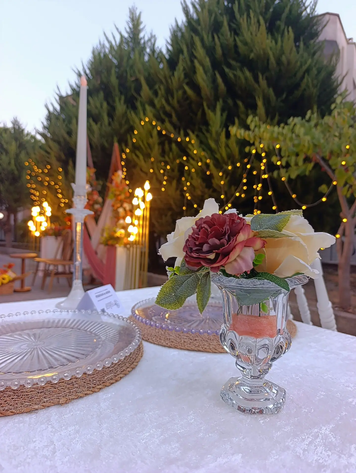 Special occasions in Kusadasi outdoor celebration table with flowers, candles and string lights