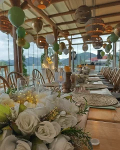 Terrace wedding reception table with hanging lanterns in Kusadasi