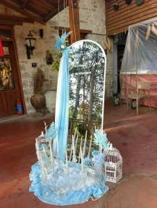 Blue wedding decoration with candles and decorative birdcages