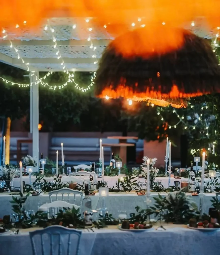 Evening wedding dinner with string lights and candles in Kusadasi