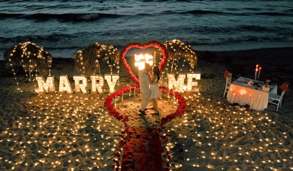 Surprise proposal Kusadasi beach setup with Marry Me letters
