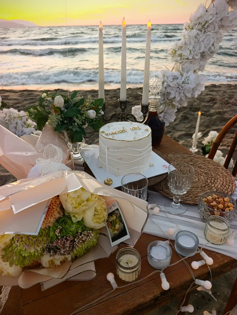 Romantic table setup with flowers and dessert for a proposal dinner