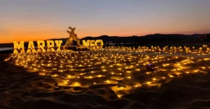 Marry Me letters on the sand at sunset in Kusadasi
